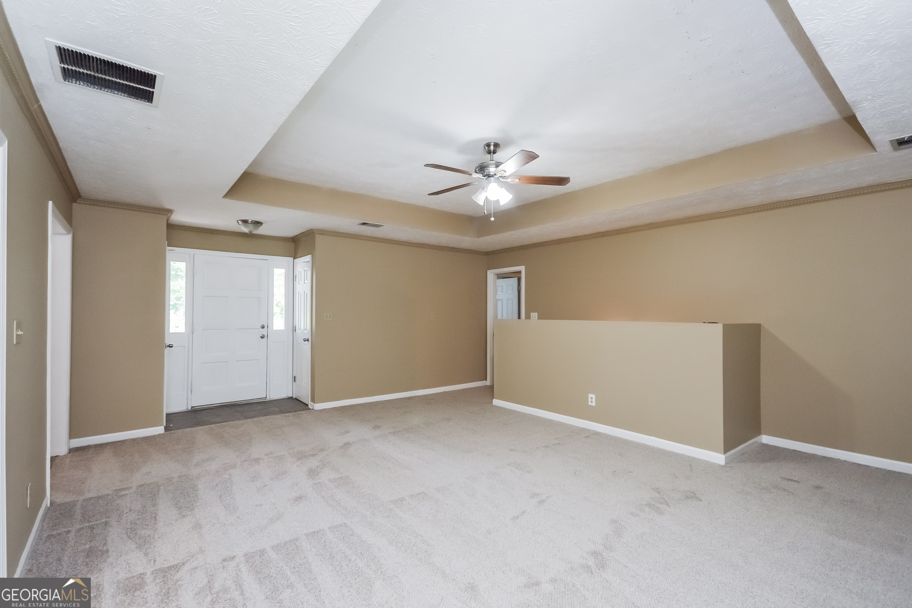 2451 Sherrie Lane Southwest Conyers, GA 30094 - Photo 3 of 17 a view of an empty room with a window