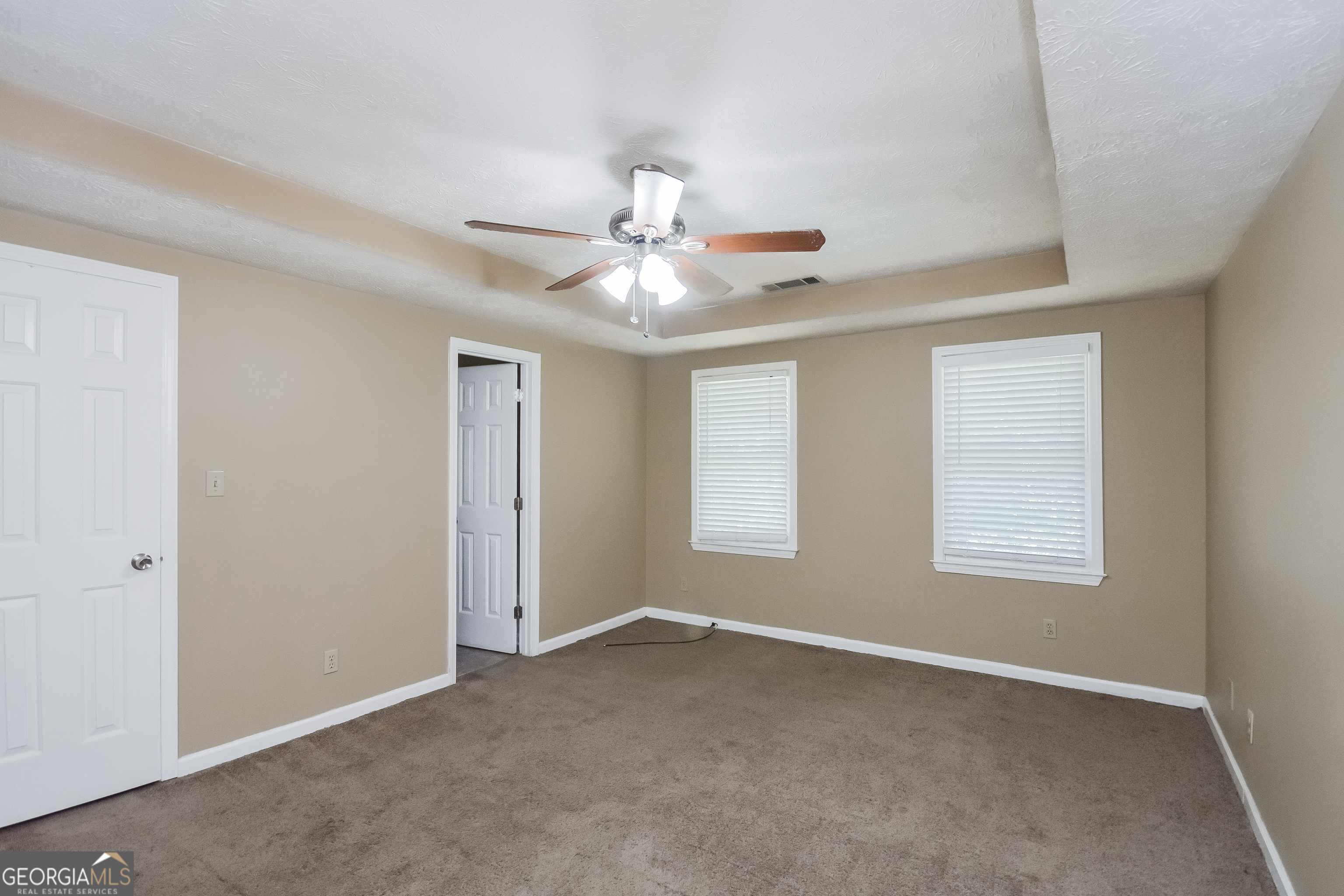 2451 Sherrie Lane Southwest Conyers, GA 30094 - Photo 8 of 17 a view of an empty room with a window