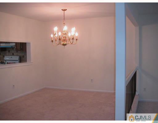 2004 Timber Oaks Road Edison, NJ 08820 - Photo 4 of 10 a view of a livingroom with a chandelier