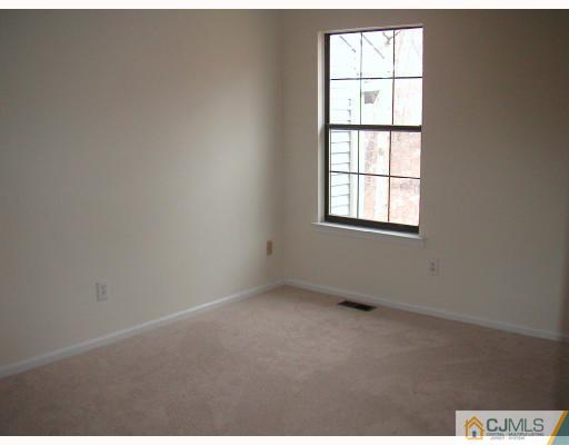 2004 Timber Oaks Road Edison, NJ 08820 - Photo 8 of 10 an empty room with a window