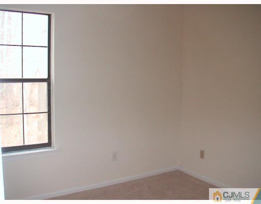 2004 Timber Oaks Road Edison, NJ 08820 - Photo 9 of 10 an empty room with a window