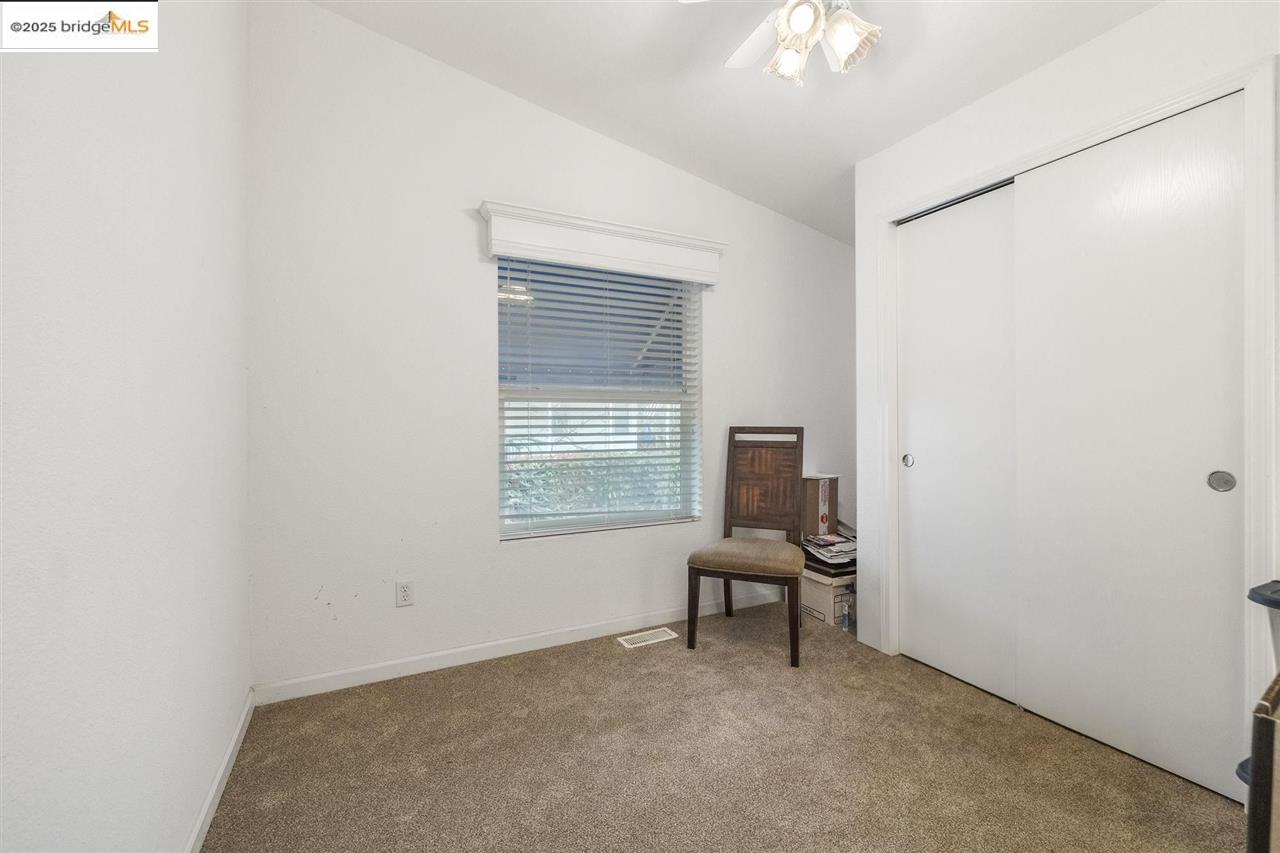 18717 Mill Villa Road, Unit 612 Jamestown, CA 95327 - Photo 12 of 22 a room with chandelier fan and windows