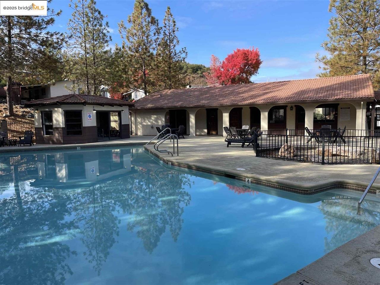 18717 Mill Villa Road, Unit 612 Jamestown, CA 95327 - Photo 20 of 22 a front view of a house with sitting area and swimming pool