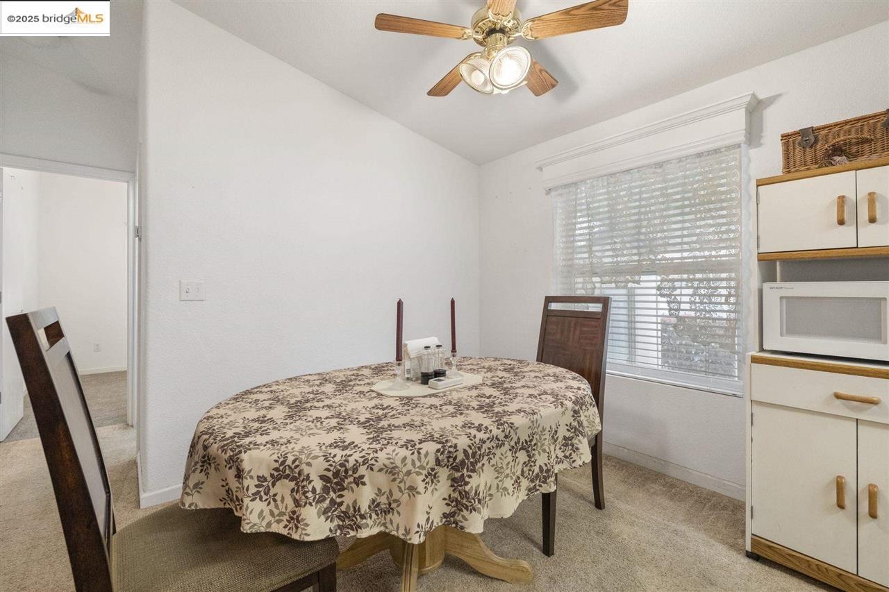 18717 Mill Villa Road, Unit 612 Jamestown, CA 95327 - Photo 6 of 22 a bedroom with a bed and a chandelier