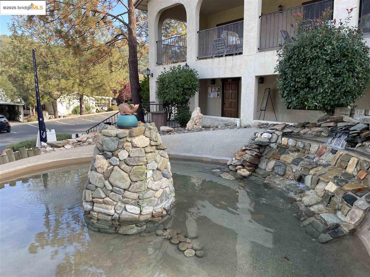 18717 Mill Villa Road, Unit 612 Jamestown, CA 95327 - Photo 7 of 22 a view of a house with a chairs in a patio