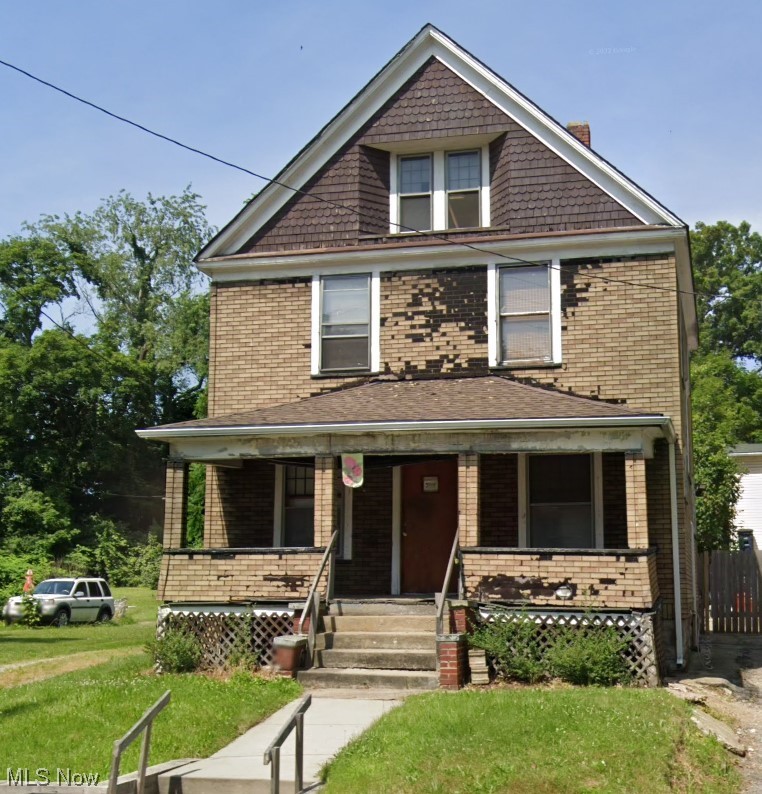 596 Rhodes Avenue Akron, OH 44307 - Photo 1 of 17 View of front of home featuring a front yard and covered porch