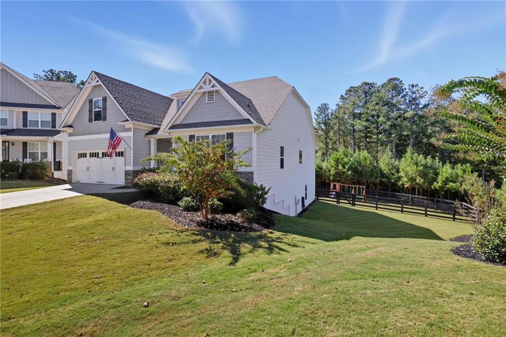 47 Violet Lane Dallas, GA 30132 - Photo 25 of 27 a front view of a house with a yard