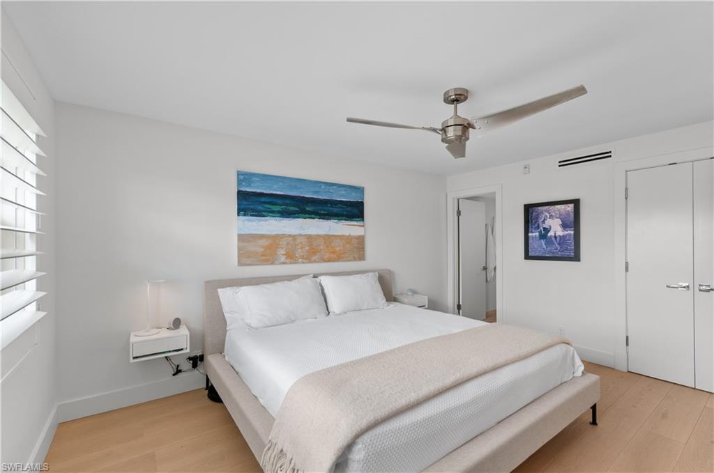 568 12th Avenue South, Unit 568 Naples, FL 34102 - Photo 18 of 34 a bedroom with a bed and a window