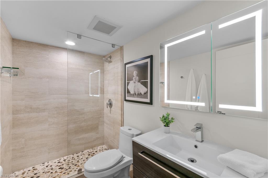 568 12th Avenue South, Unit 568 Naples, FL 34102 - Photo 20 of 34 a bathroom with a sink a toilet and shower