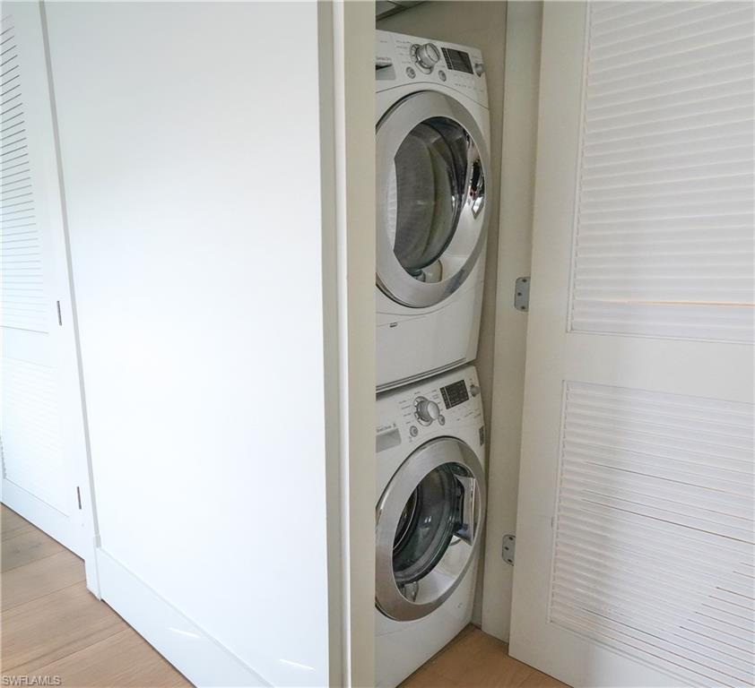568 12th Avenue South, Unit 568 Naples, FL 34102 - Photo 22 of 34 a utility room with dryer and washer