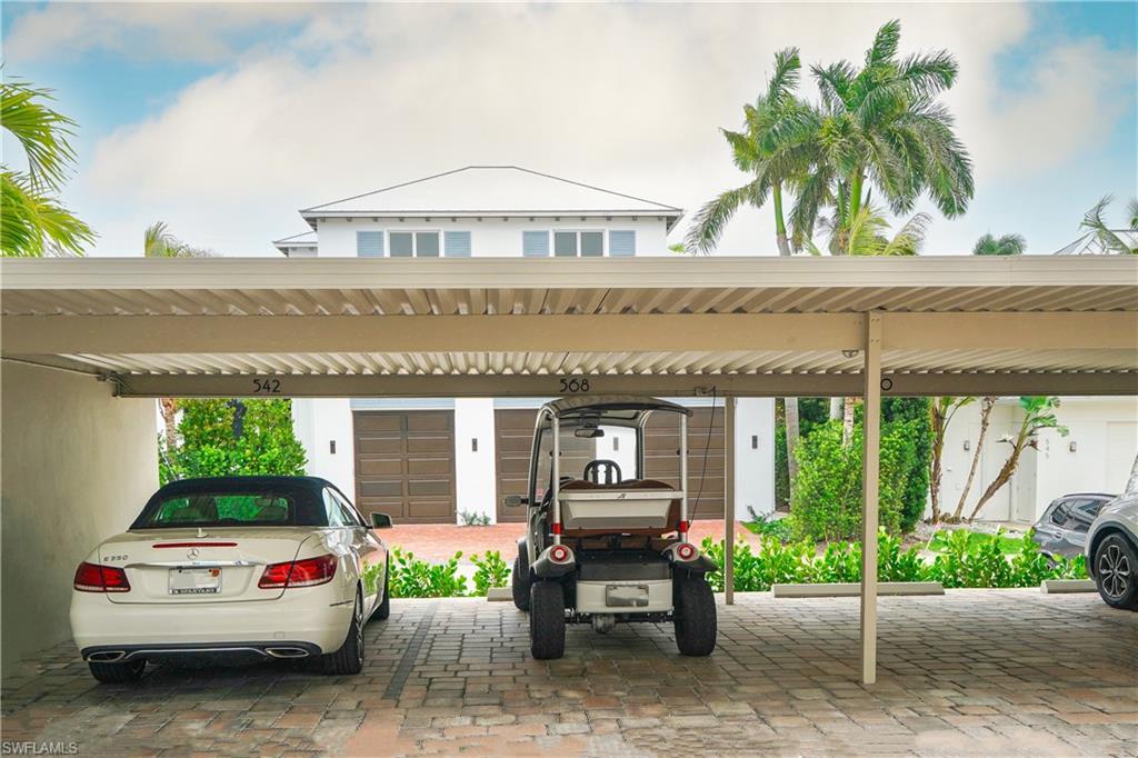 568 12th Avenue South, Unit 568 Naples, FL 34102 - Photo 23 of 34 a view of a car park in front of a building