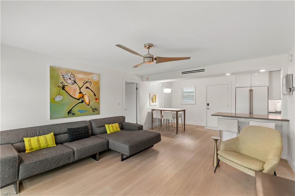 568 12th Avenue South, Unit 568 Naples, FL 34102 - Photo 10 of 34 a living room with furniture and a ceiling fan
