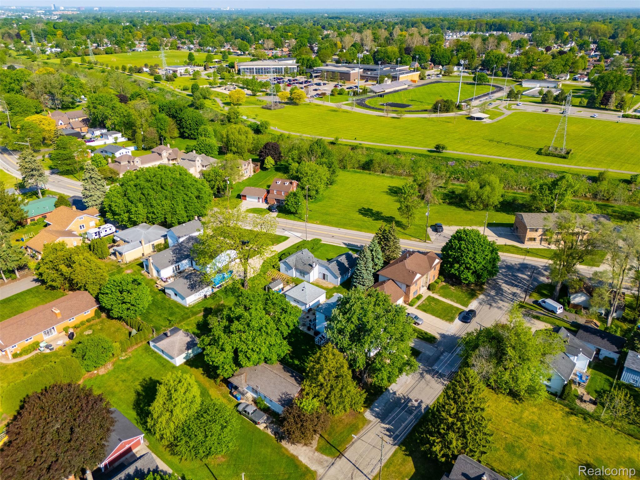 5634 Chicago Road Warren, MI 48092 - Photo 32 of 36 Aerial perspective showcasing residential properties with established trees and surrounding green spaces