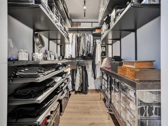 a kitchen with wooden cabinets and a stove top oven