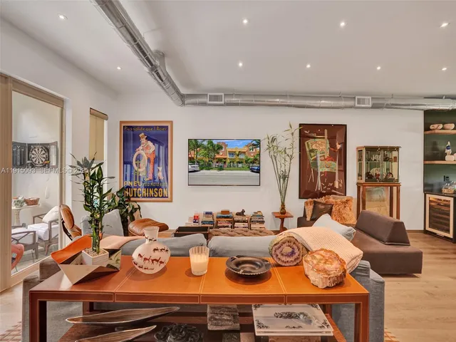 a living room with dining table and chairs