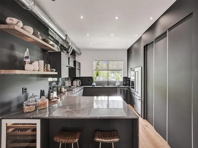 a kitchen with counter top space cabinets and stainless steel appliances