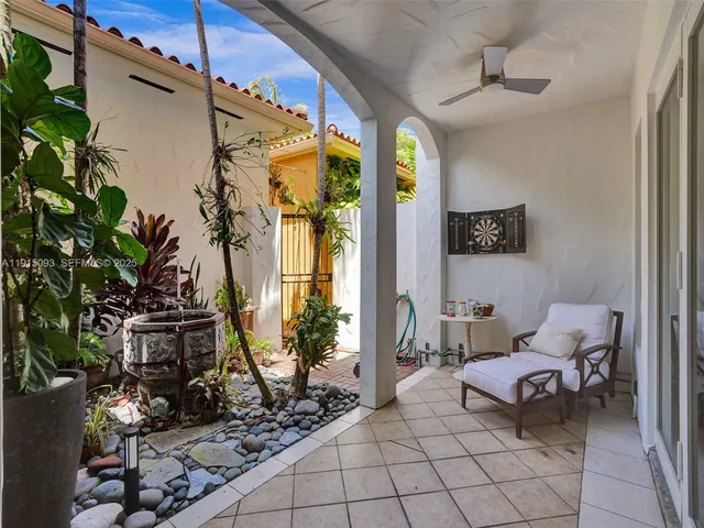 a living room with patio furniture