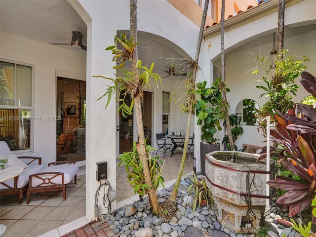 a view of a chairs and table in a patio