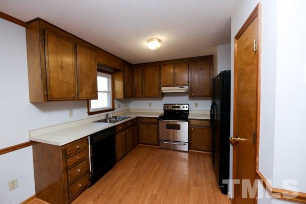143 Riders Ridge Lane Willow Spring, NC 27592 - Photo 3 of 12 Kitchen area has an attached dining area.