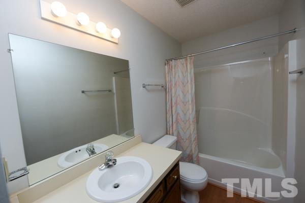 143 Riders Ridge Lane Willow Spring, NC 27592 - Photo 7 of 12 This bathroom is shared with the two bedrooms.