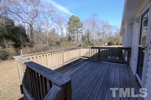 143 Riders Ridge Lane Willow Spring, NC 27592 - Photo 10 of 12 Nice sizable back deck overlooking a large backyard.