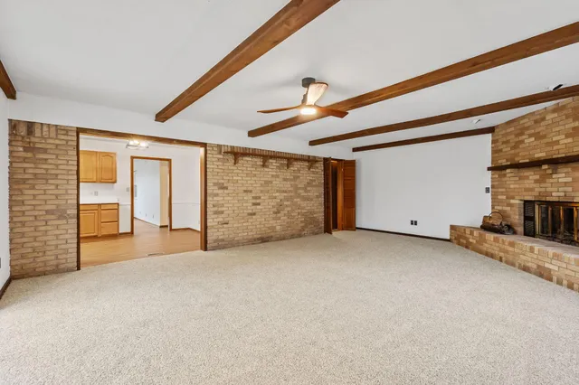 a view of an empty room with closet