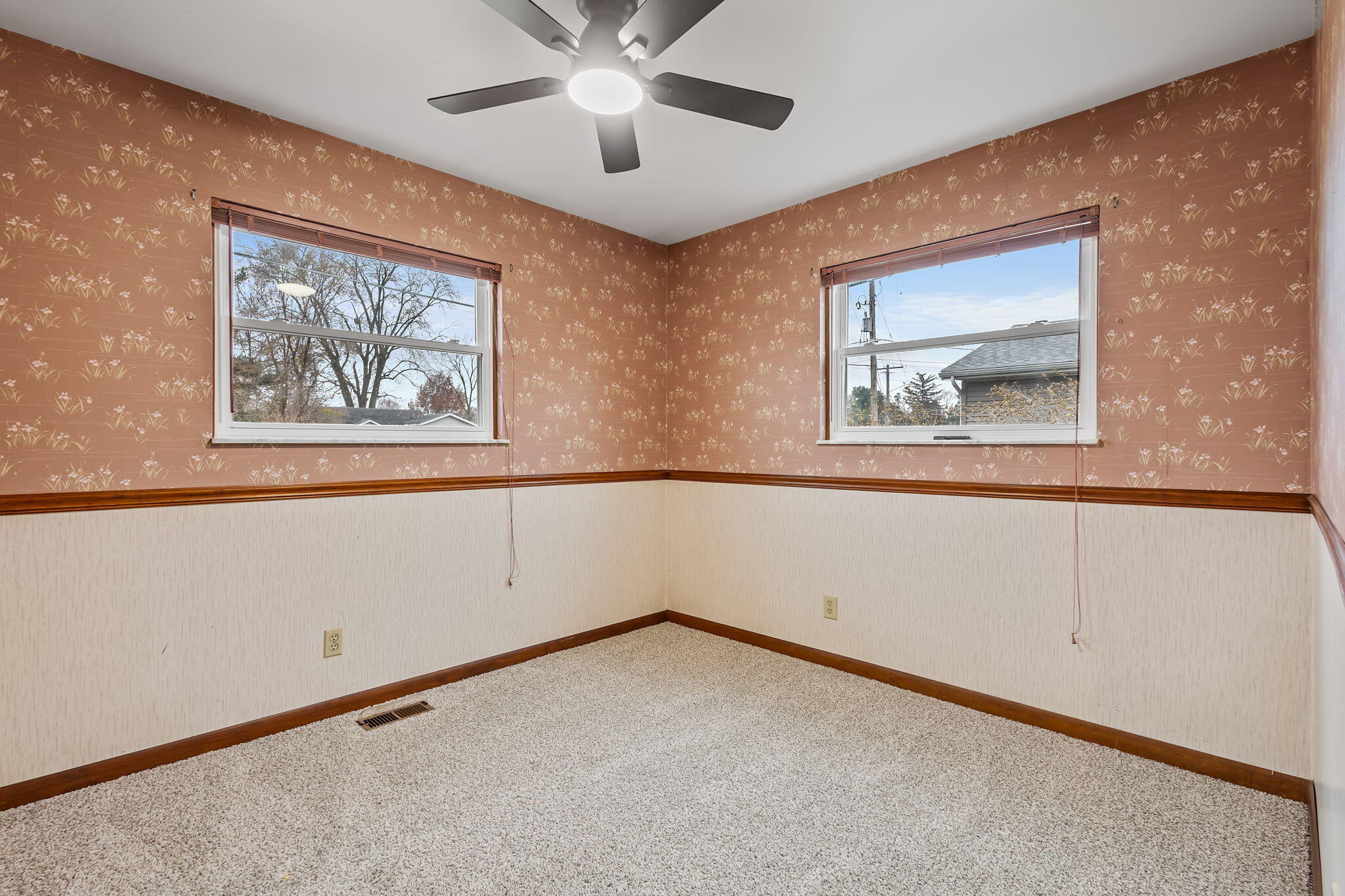 708 East Maple Street Rensselaer, IN 47978 - Photo 19 of 33 an empty room with windows and fan