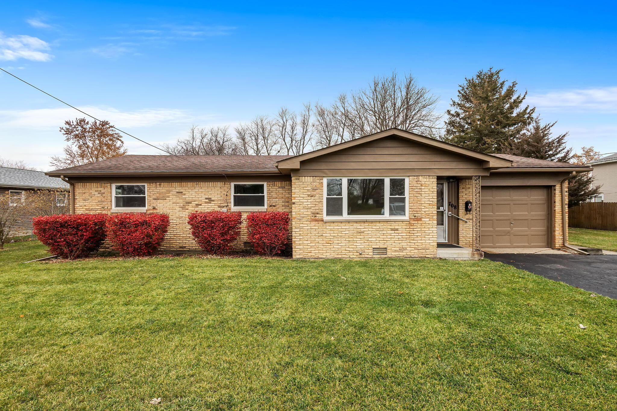 708 East Maple Street Rensselaer, IN 47978 - Photo 2 of 33 a front view of a house with a garden