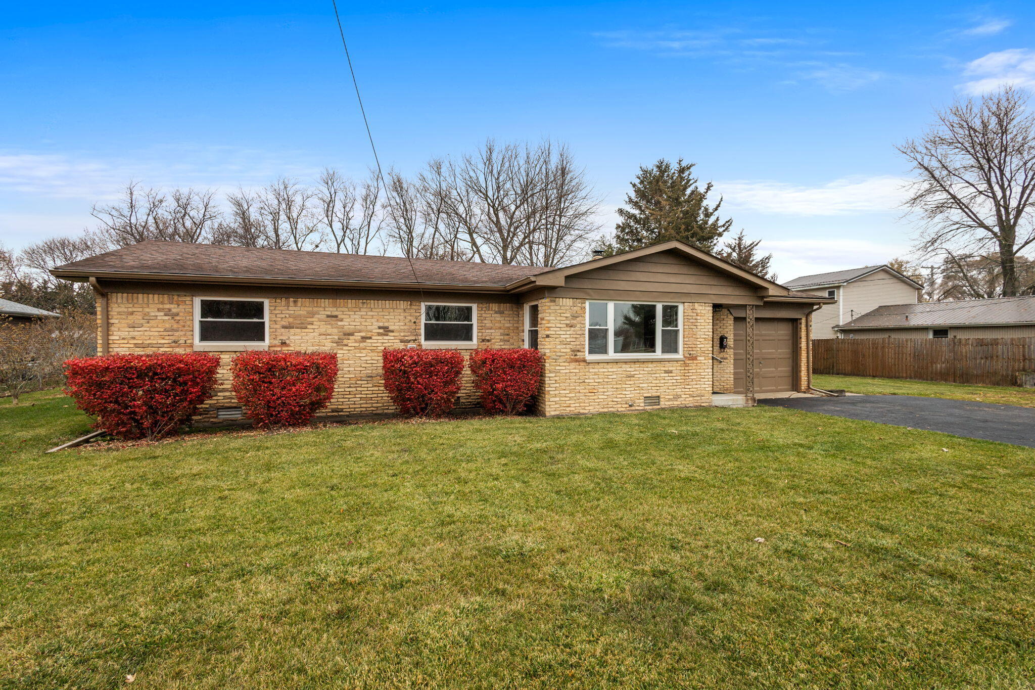 708 East Maple Street Rensselaer, IN 47978 - Photo 3 of 33 a front view of a house with a garden