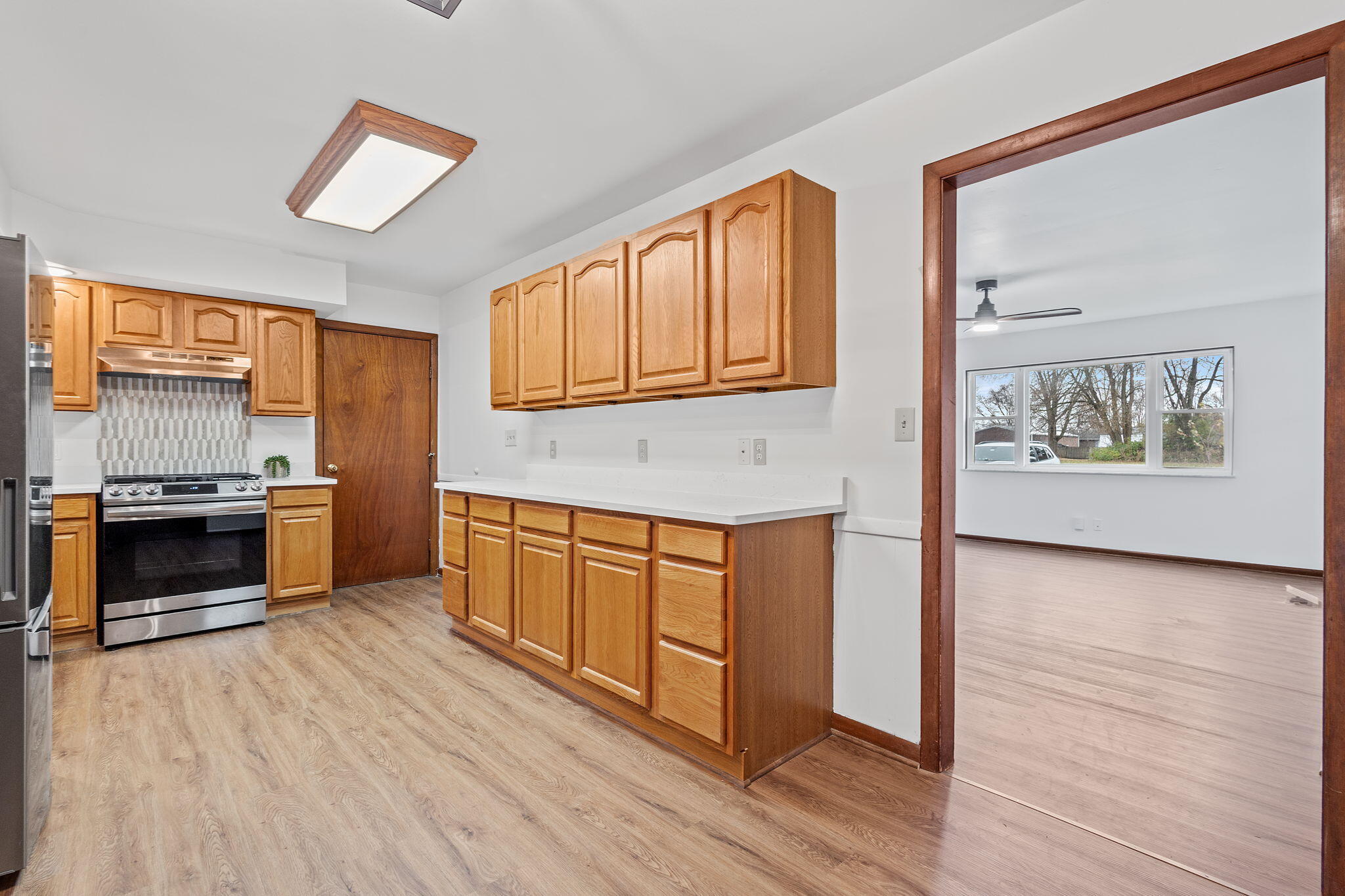 708 East Maple Street Rensselaer, IN 47978 - Photo 10 of 33 a kitchen with stainless steel appliances granite countertop a stove a sink and a microwave