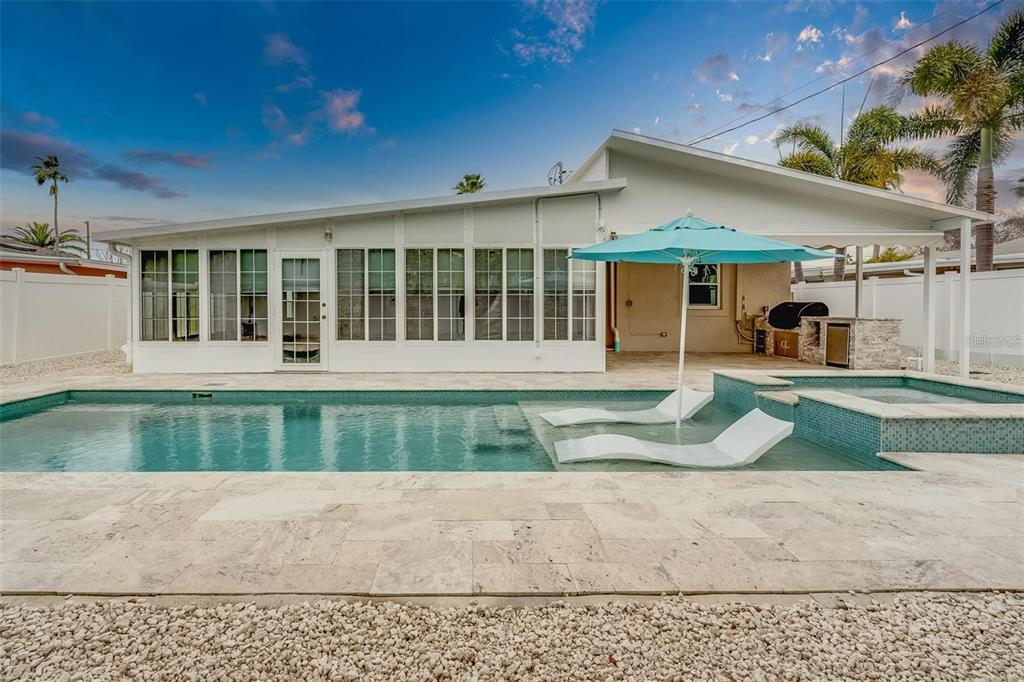 16108 Redington Drive Redington Beach, FL 33708 - Photo 11 of 13 front view of a house with a yard