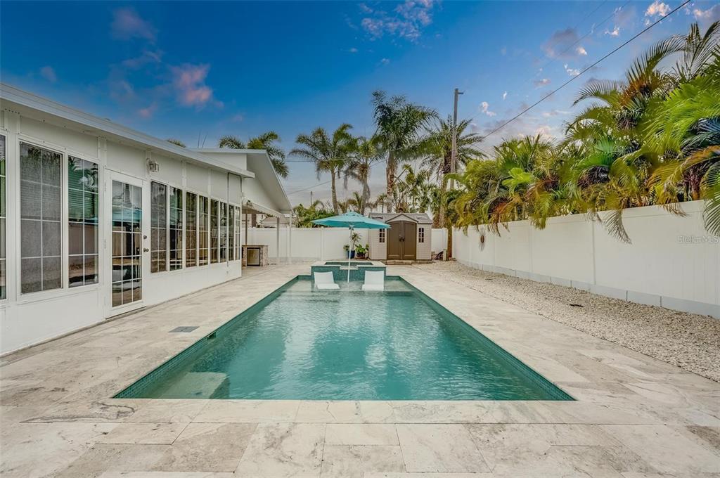 16108 Redington Drive Redington Beach, FL 33708 - Photo 13 of 13 a swimming pool with outdoor seating and yard