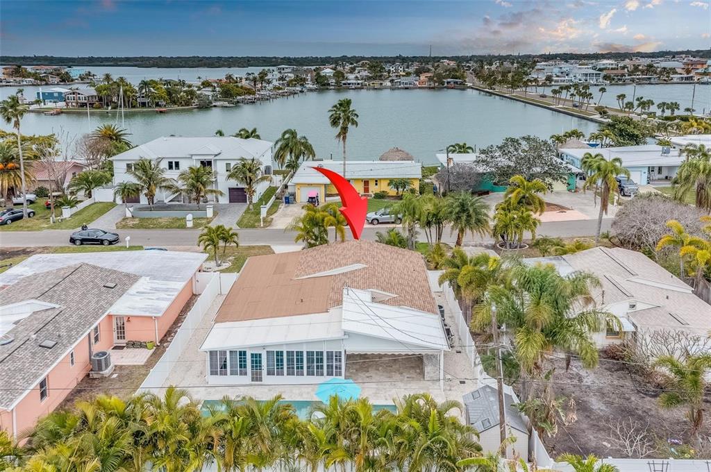 16108 Redington Drive Redington Beach, FL 33708 - Photo 2 of 13 an aerial view of a house with a swimming pool