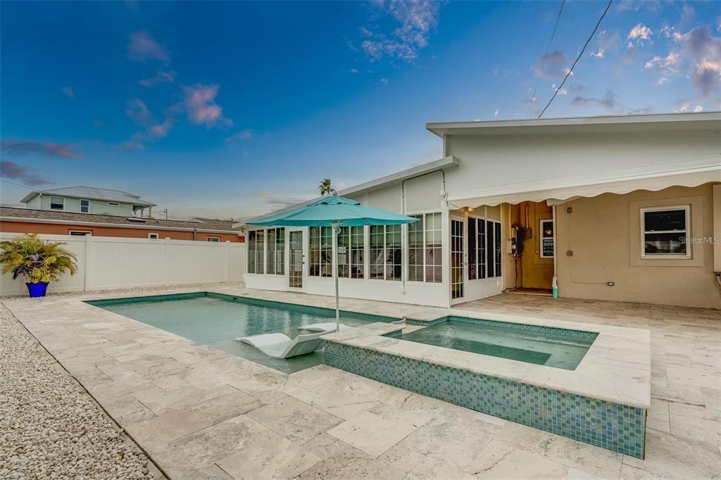 16108 Redington Drive Redington Beach, FL 33708 - Photo 8 of 13 a view of a house with a yard