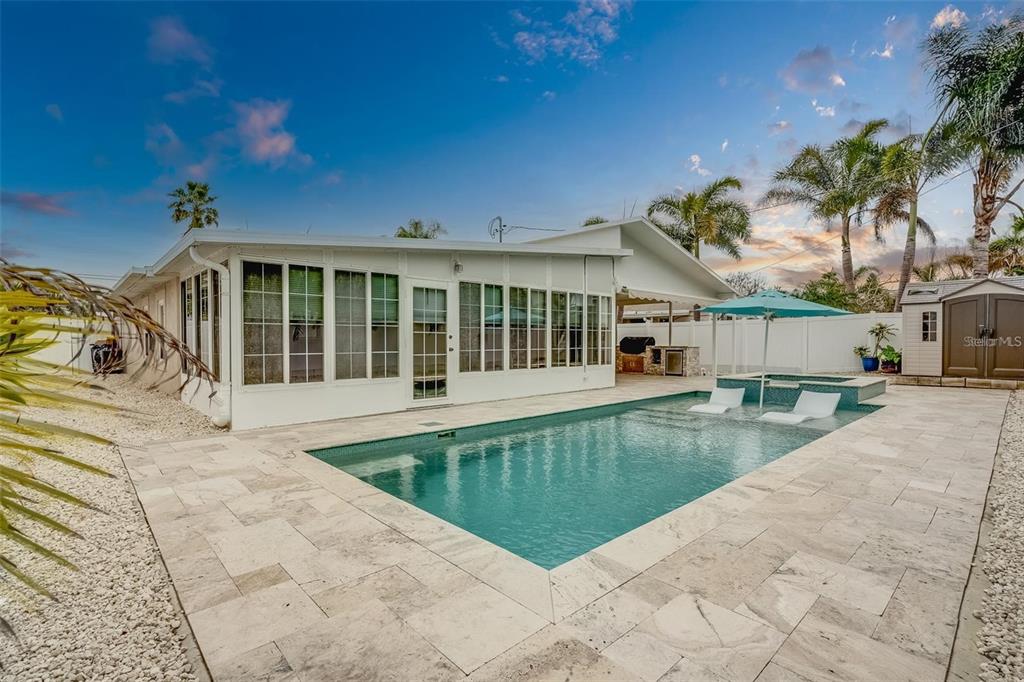 16108 Redington Drive Redington Beach, FL 33708 - Photo 9 of 13 a view of a house with a swimming pool