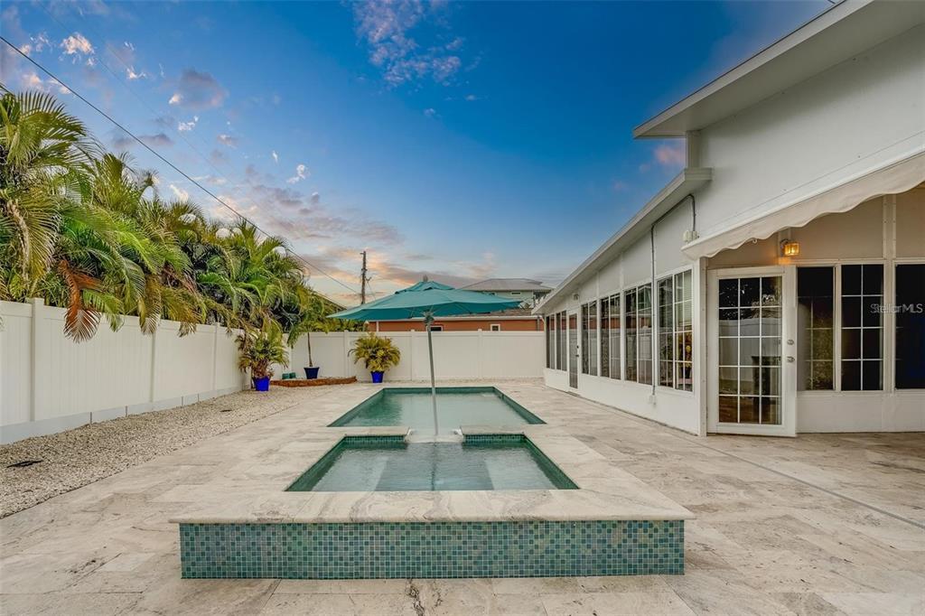 16108 Redington Drive Redington Beach, FL 33708 - Photo 10 of 13 a view of a house with a yard