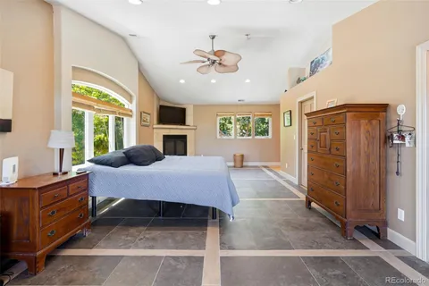 a bedroom with furniture and window