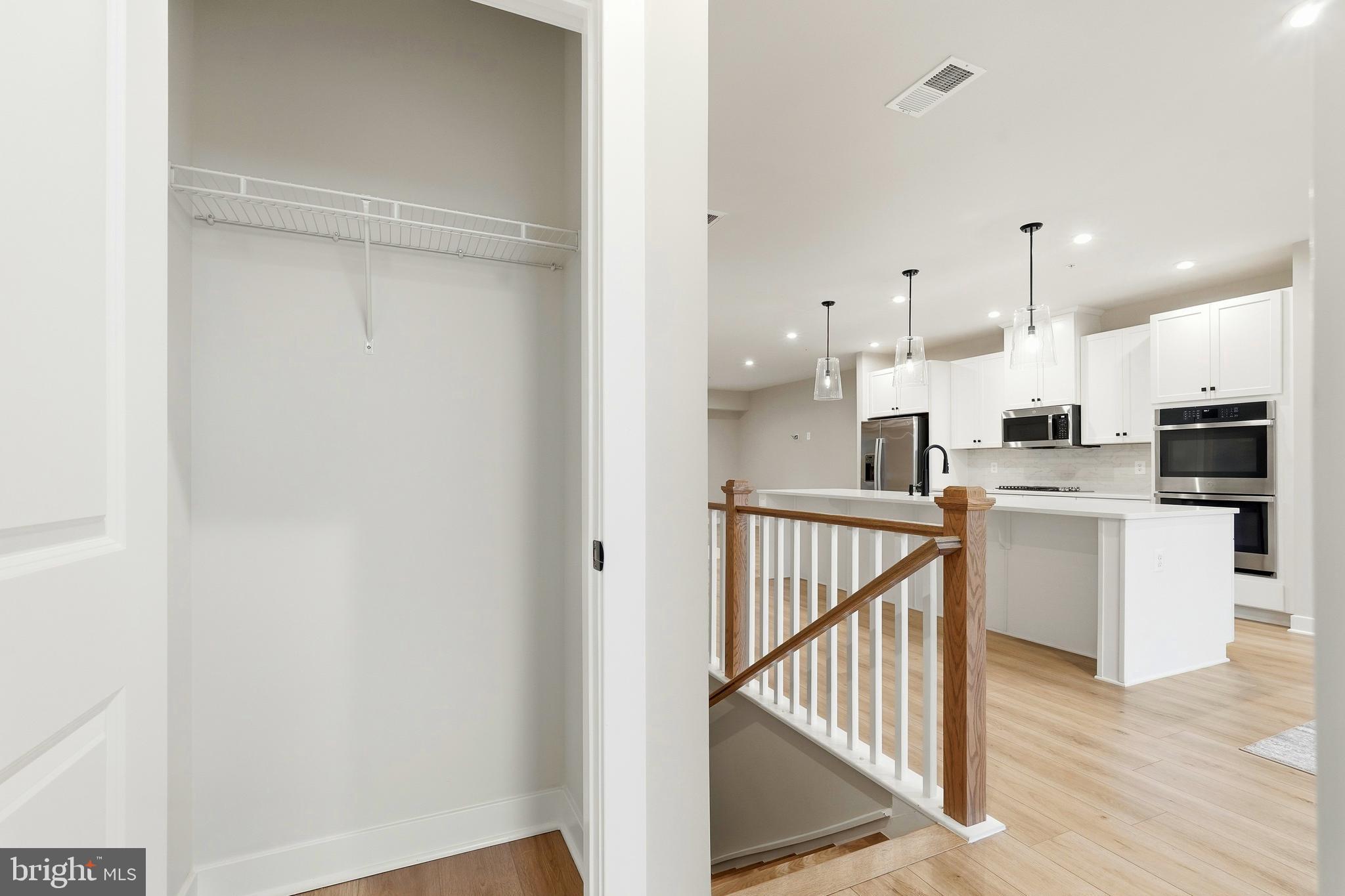 14538 George Carter Way, Unit 287 Chantilly, VA 20151 - Photo 15 of 87 a view of kitchen with wooden floor