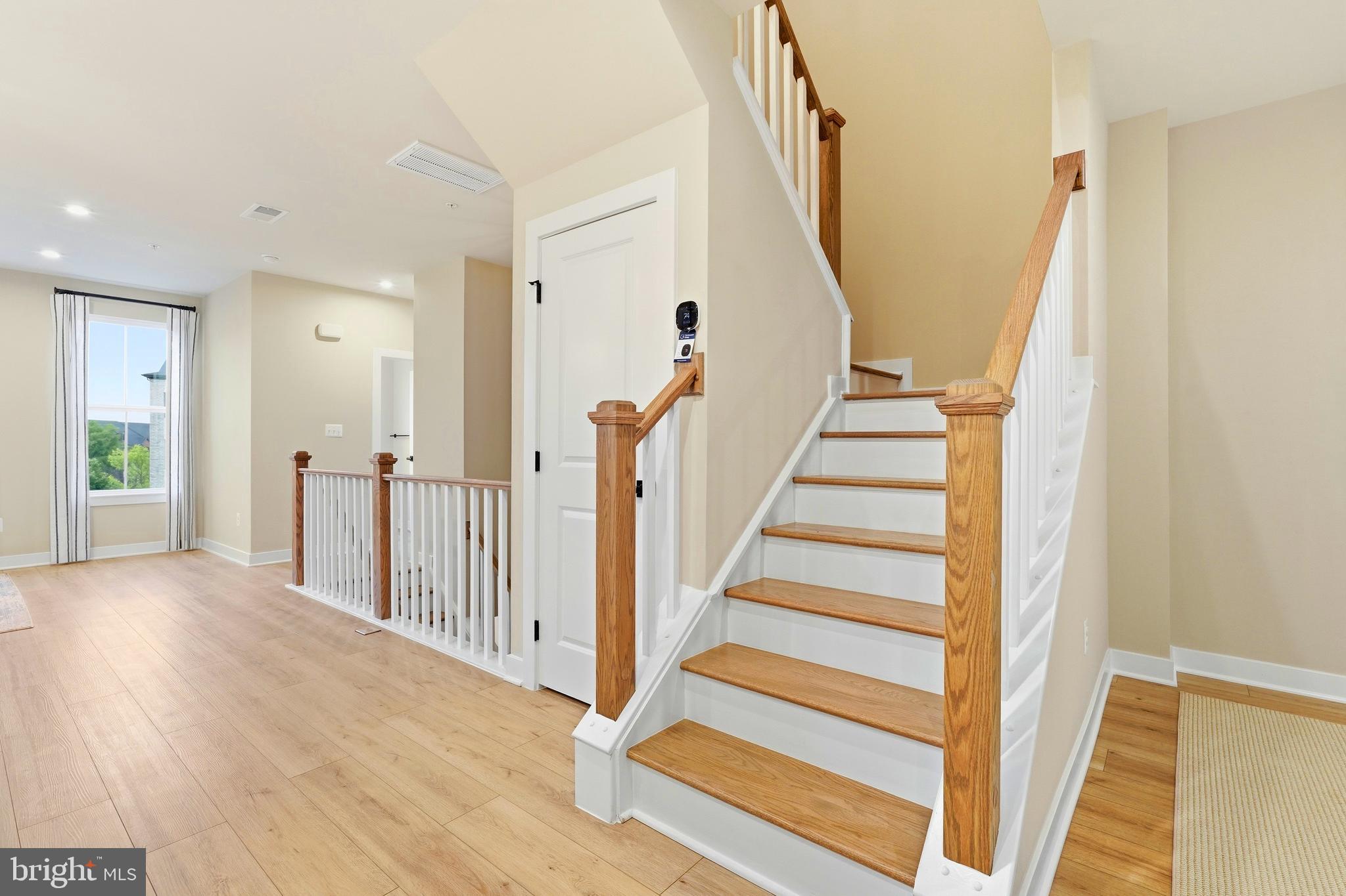 14538 George Carter Way, Unit 287 Chantilly, VA 20151 - Photo 17 of 87 a view of a hallway with wooden floor and entryway