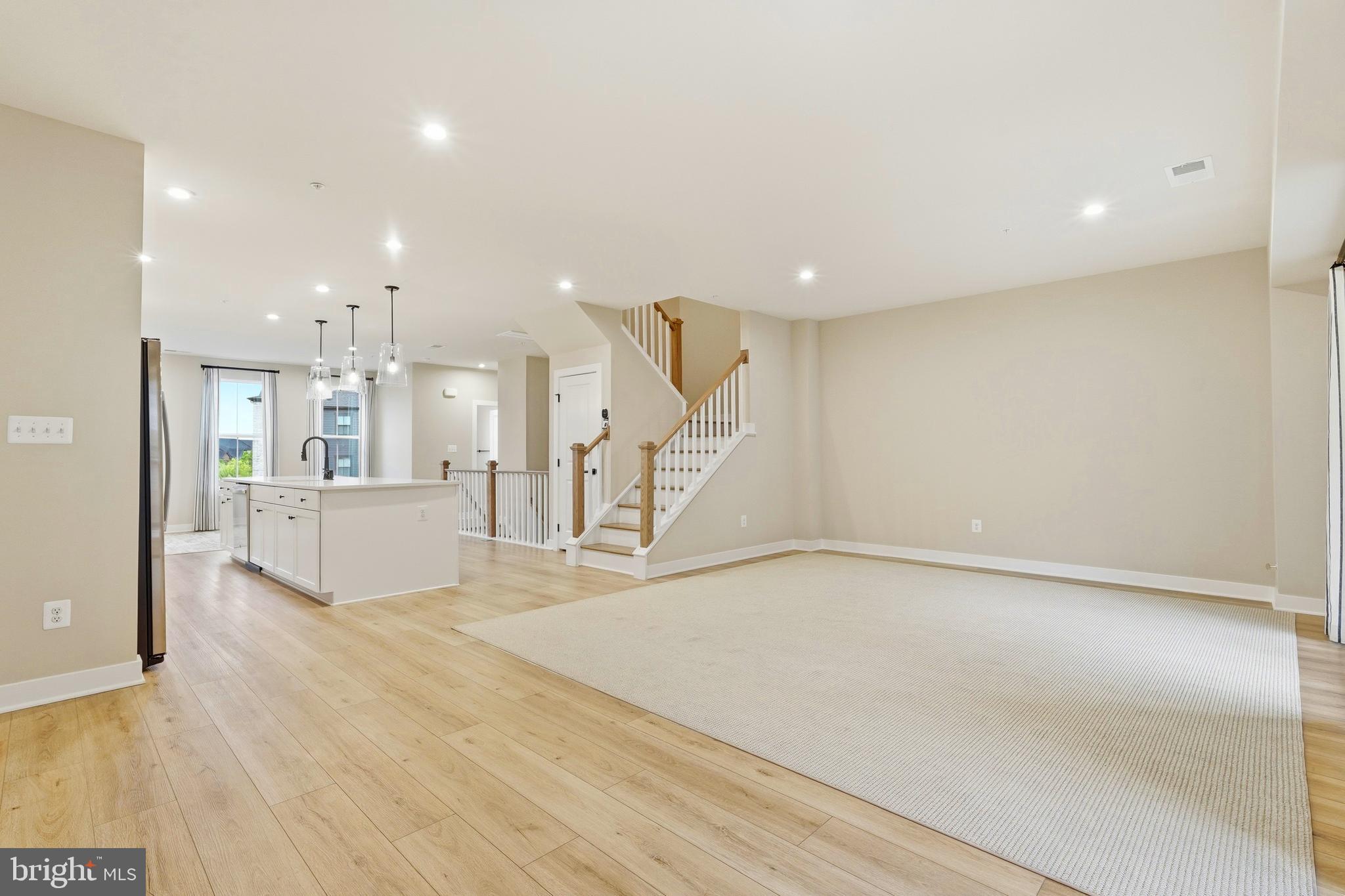14538 George Carter Way, Unit 287 Chantilly, VA 20151 - Photo 22 of 87 a view of an empty room with kitchen and a window