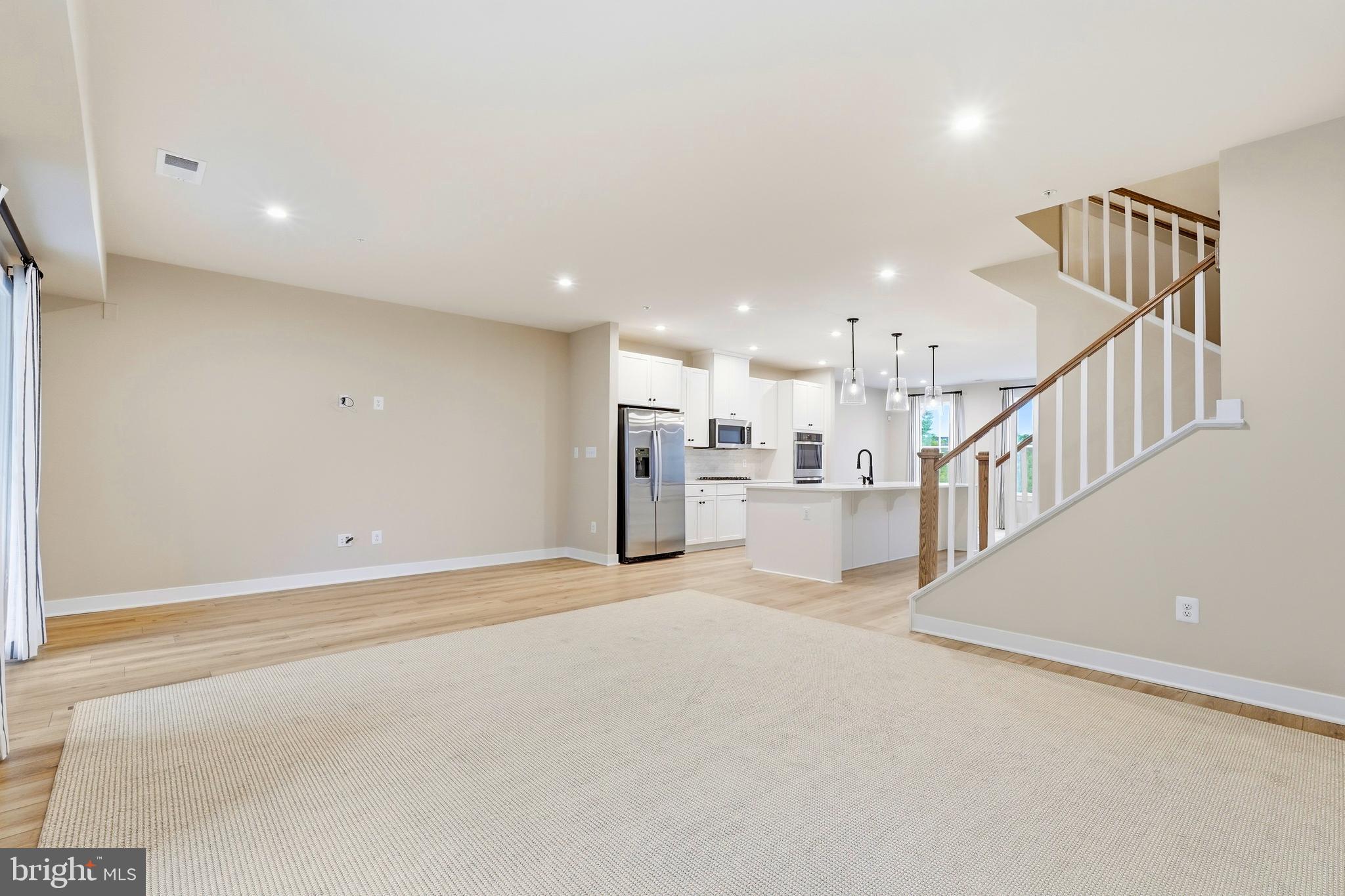 14538 George Carter Way, Unit 287 Chantilly, VA 20151 - Photo 23 of 87 a view of a kitchen with furniture and stairs