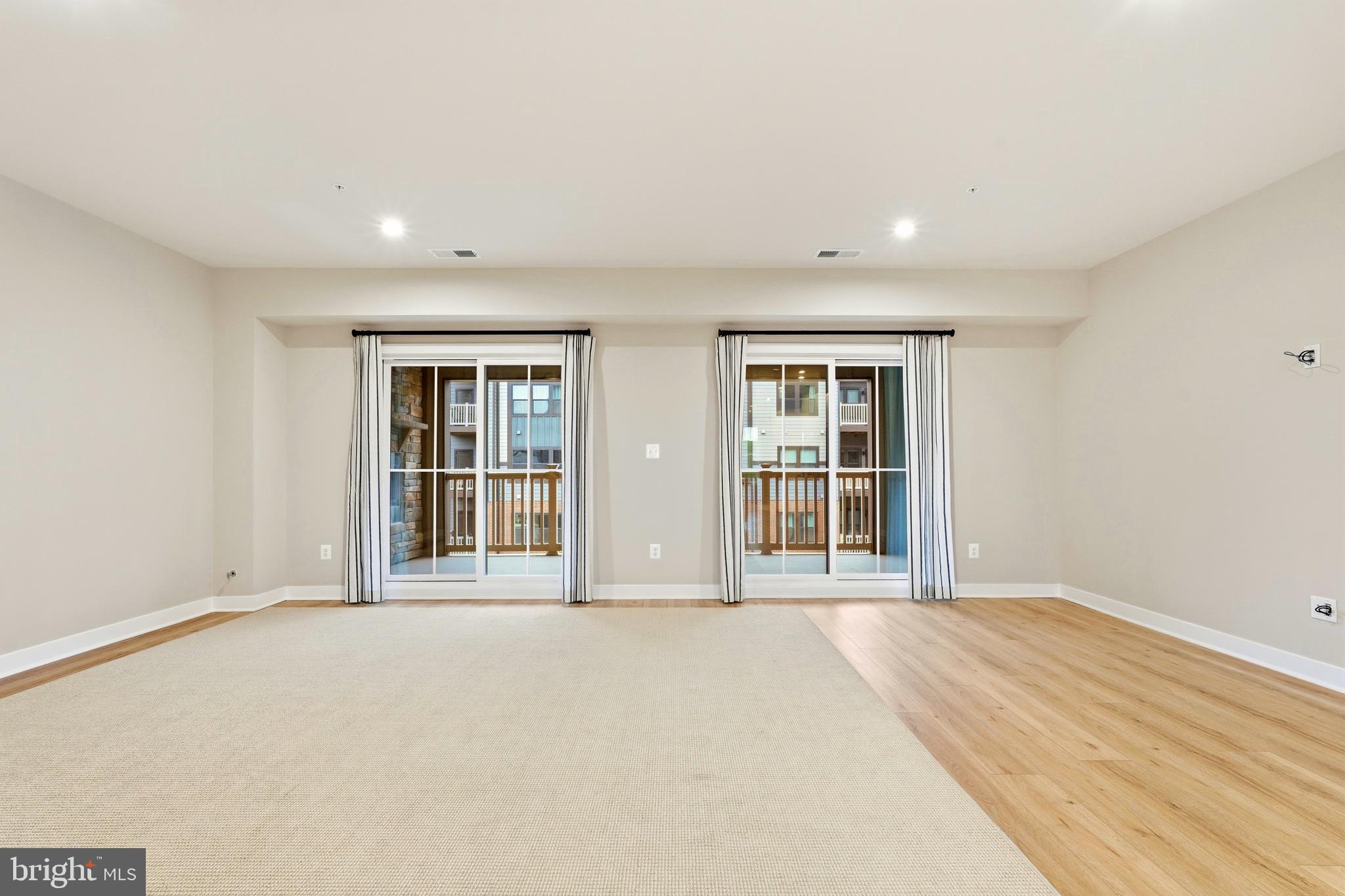 14538 George Carter Way, Unit 287 Chantilly, VA 20151 - Photo 24 of 87 a view of an empty room with a window