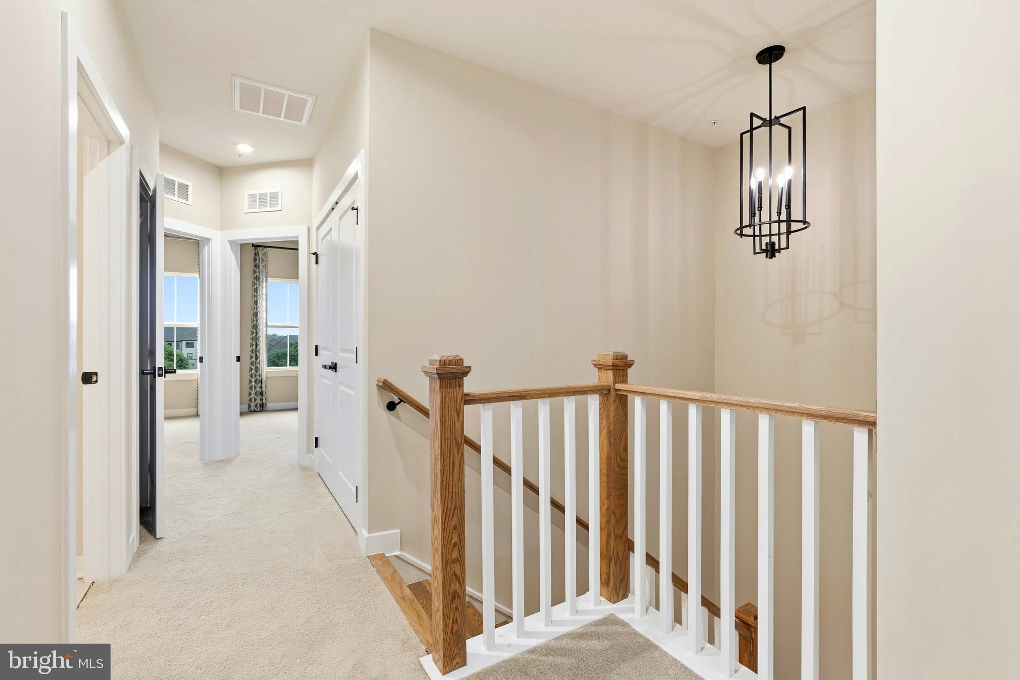 14538 George Carter Way, Unit 287 Chantilly, VA 20151 - Photo 34 of 87 a view of hallway with chandelier