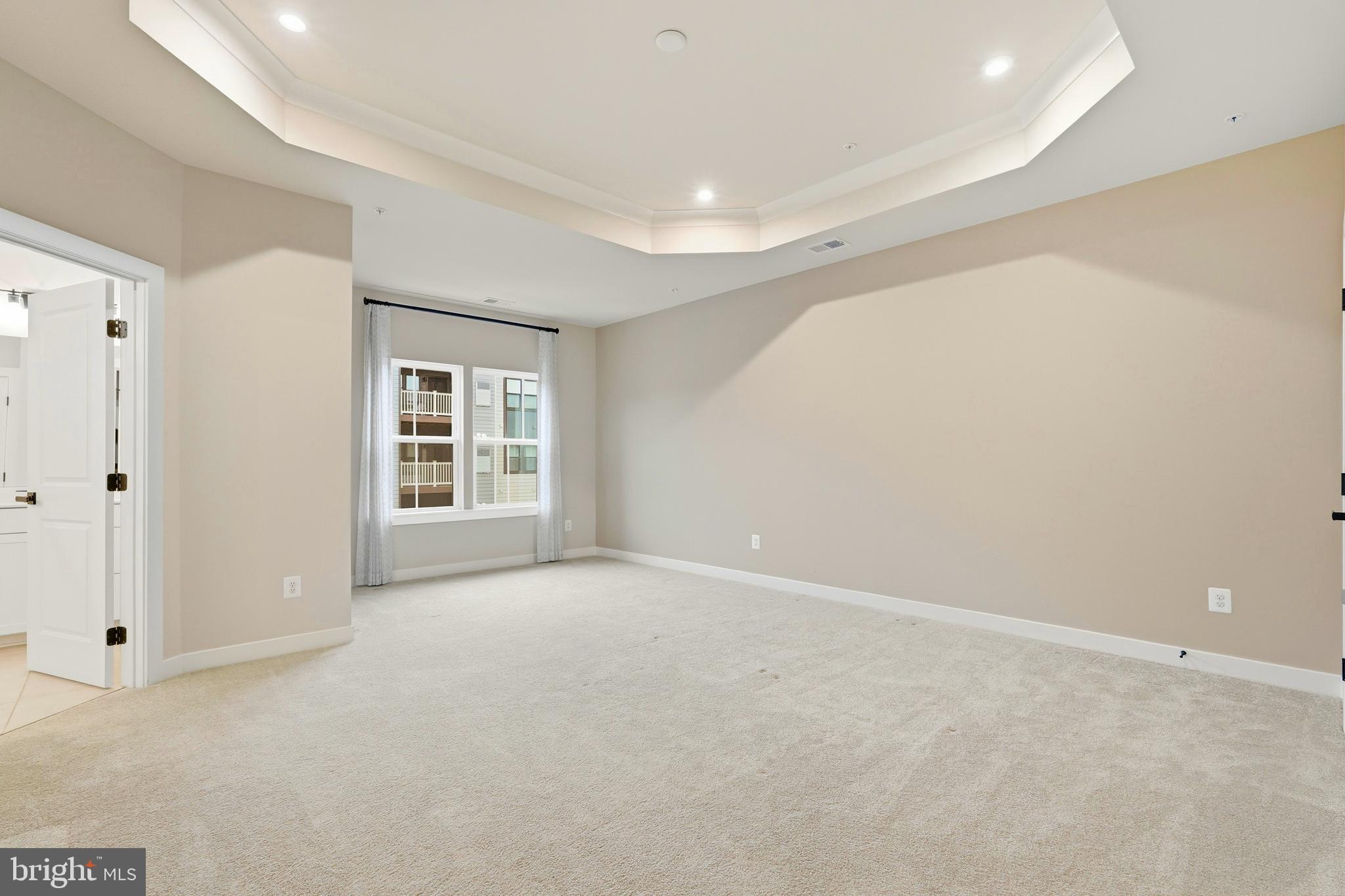 14538 George Carter Way, Unit 287 Chantilly, VA 20151 - Photo 39 of 87 a view of an empty room with a window