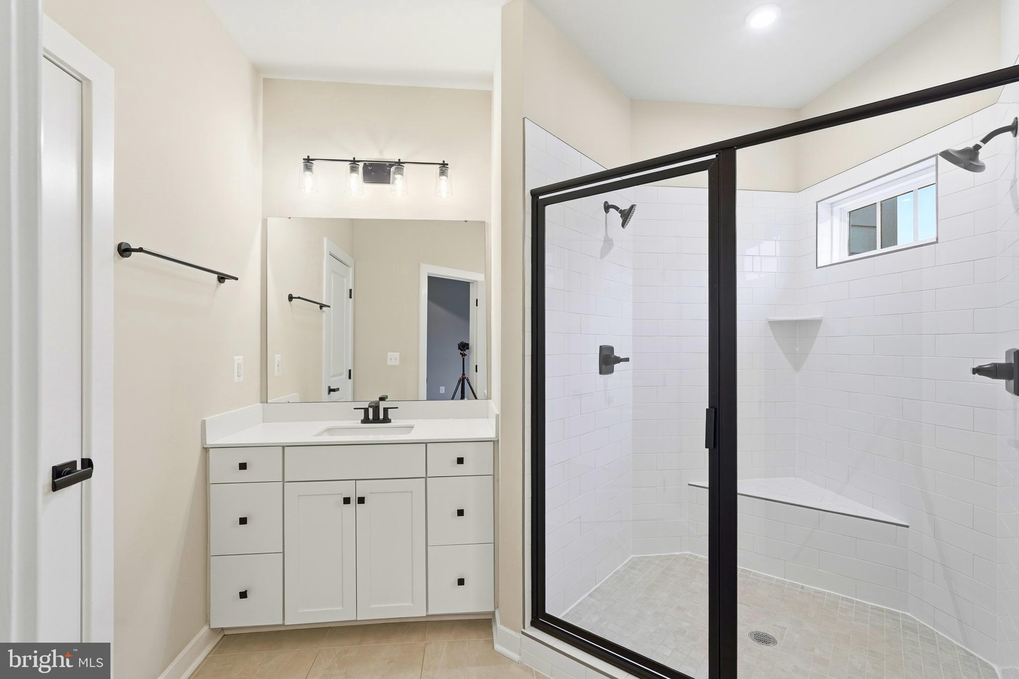 14538 George Carter Way, Unit 287 Chantilly, VA 20151 - Photo 40 of 87 a bathroom with a double vanity sink mirror and shower