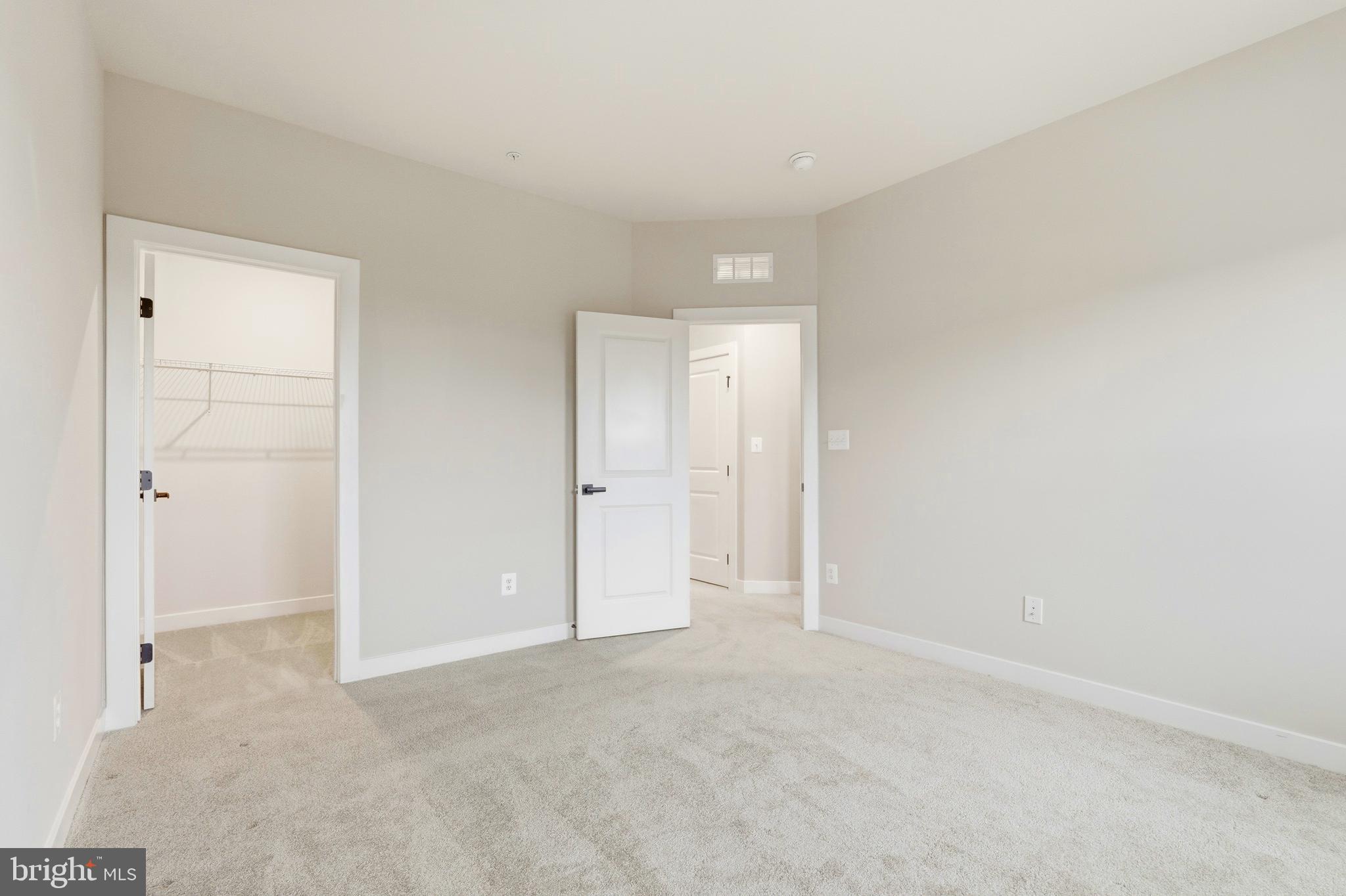 14538 George Carter Way, Unit 287 Chantilly, VA 20151 - Photo 50 of 87 an empty room with closet area
