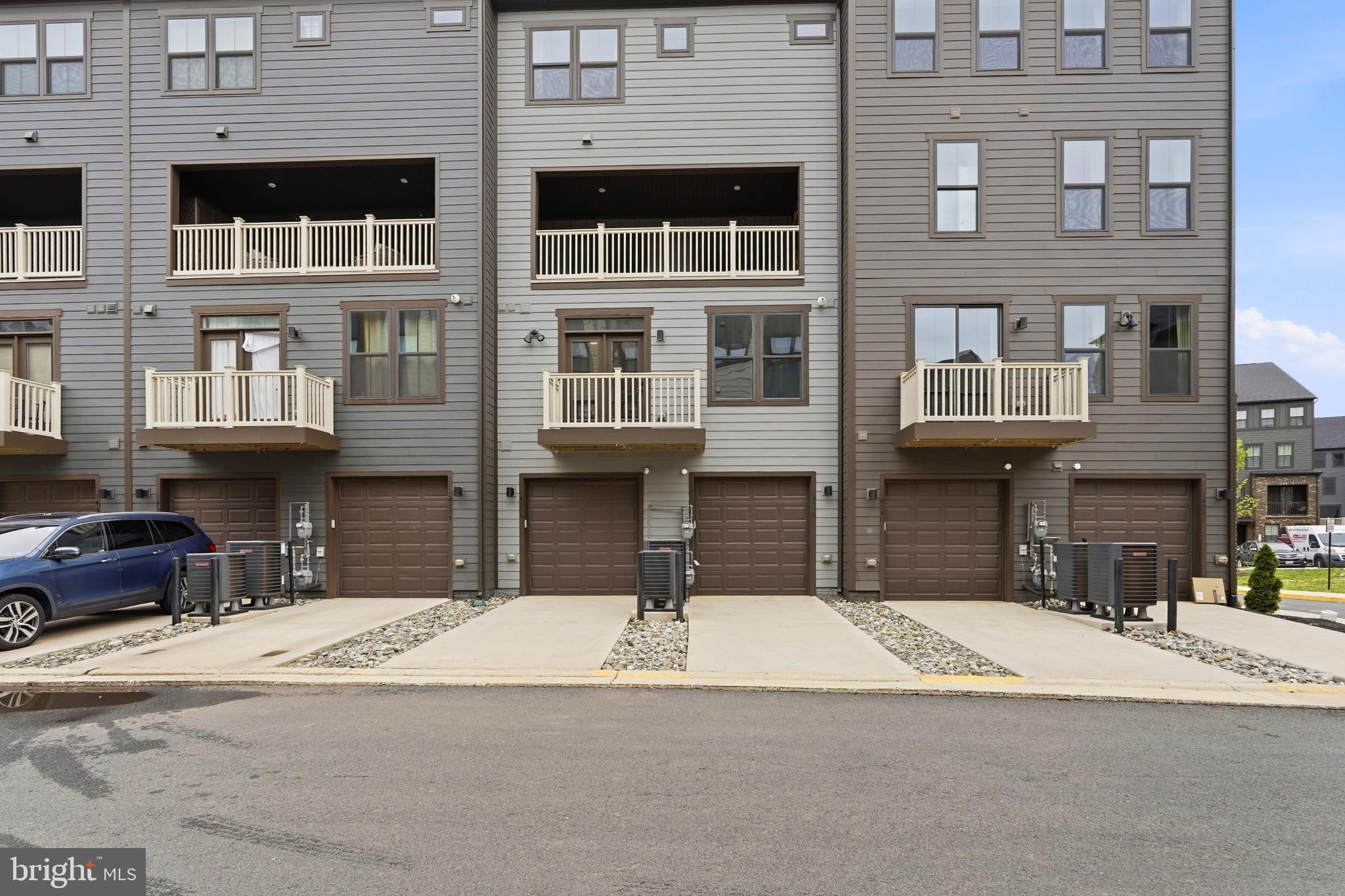 14538 George Carter Way, Unit 287 Chantilly, VA 20151 - Photo 69 of 87 a view of a building with a street