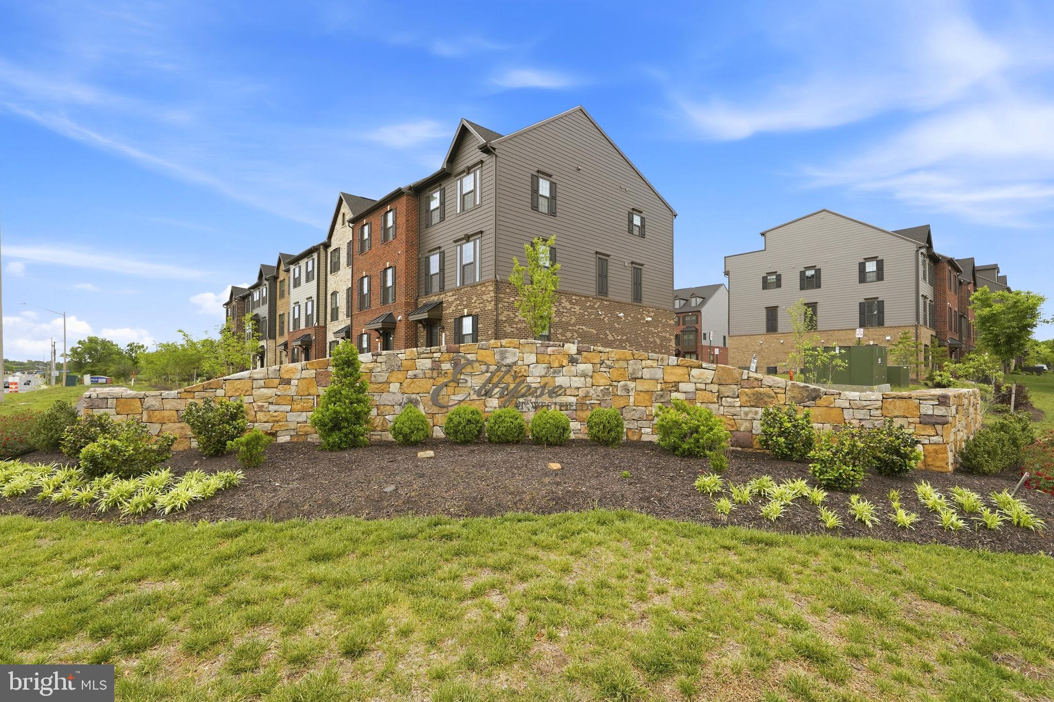 14538 George Carter Way, Unit 287 Chantilly, VA 20151 - Photo 85 of 87 a front view of a house with a yard