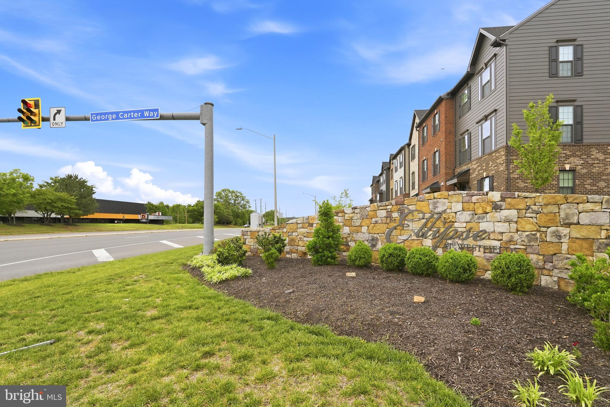 14538 George Carter Way, Unit 287 Chantilly, VA 20151 - Photo 86 of 87 a view of a lake with a houses