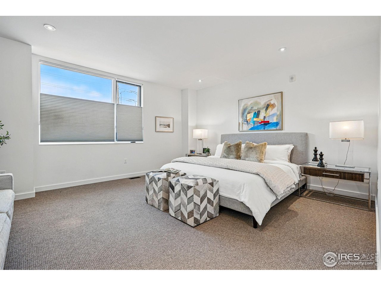 1916 23rd Street, Unit 6 Boulder, CO 80302 - Photo 16 of 27 a bedroom with a bed and a painting on the wall